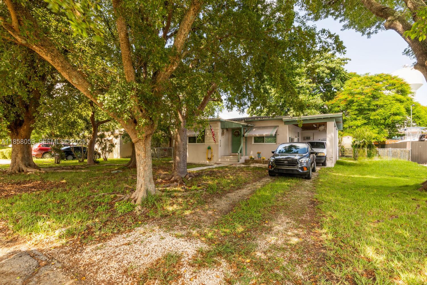 846 Northwest 3rd Avenue Homestead, FL 33030 - Photo 8 of 13 a view of a house with cars parked in a yard