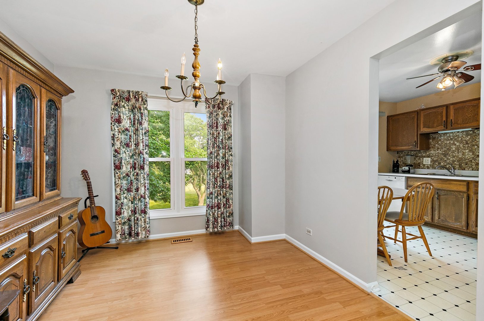 114 Sherman Street Bartlett, IL 60103 - Photo 3 of 17 a view of a livingroom with furniture window and wooden floor
