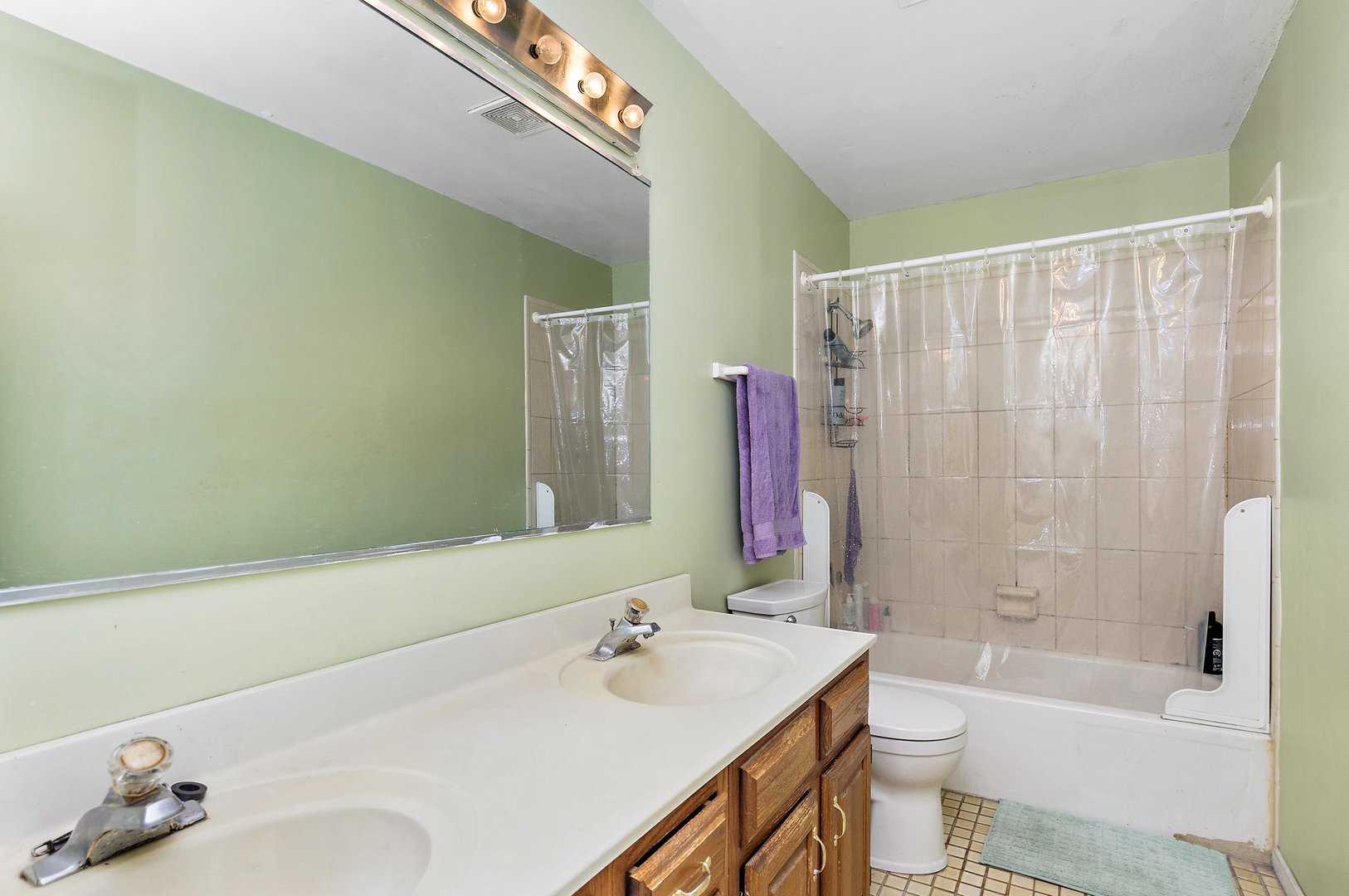 114 Sherman Street Bartlett, IL 60103 - Photo 7 of 17 a bathroom with a sink toilet and shower