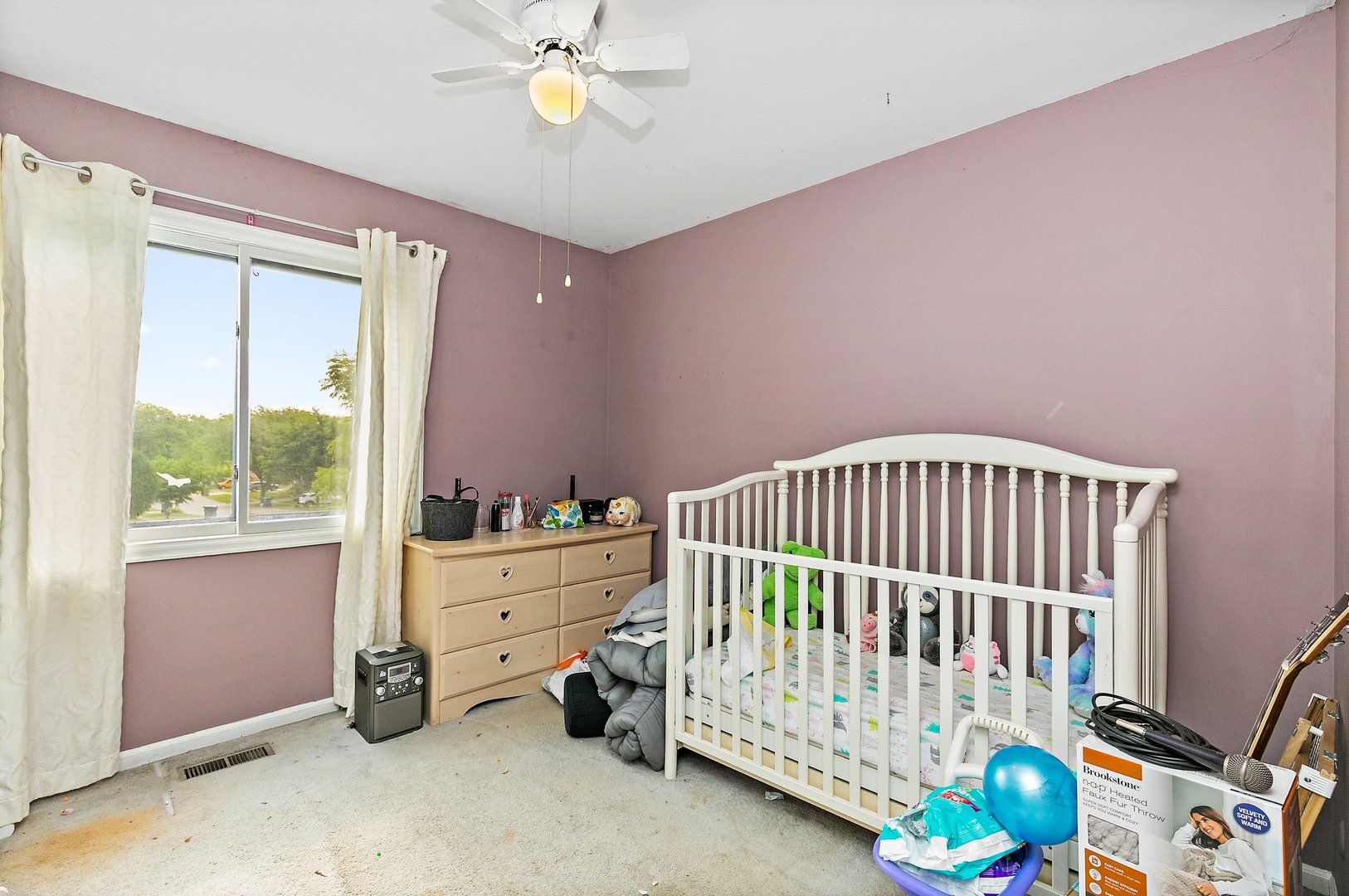 114 Sherman Street Bartlett, IL 60103 - Photo 9 of 17 a bedroom with a bed and a window