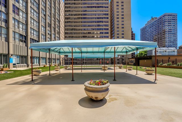 655 West Irving Park Road, Unit 4613 Chicago, IL 60613 - Photo 25 of 26 a view of a swimming pool with a patio