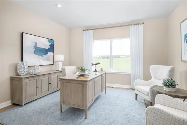a living room with furniture and windows