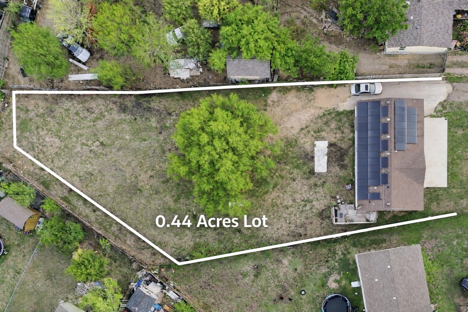 580 Railyard Drive Kyle, TX 78640 - Photo 3 of 20 Expansive 0.44-acre lot featuring a mature tree, providing ample space and potential