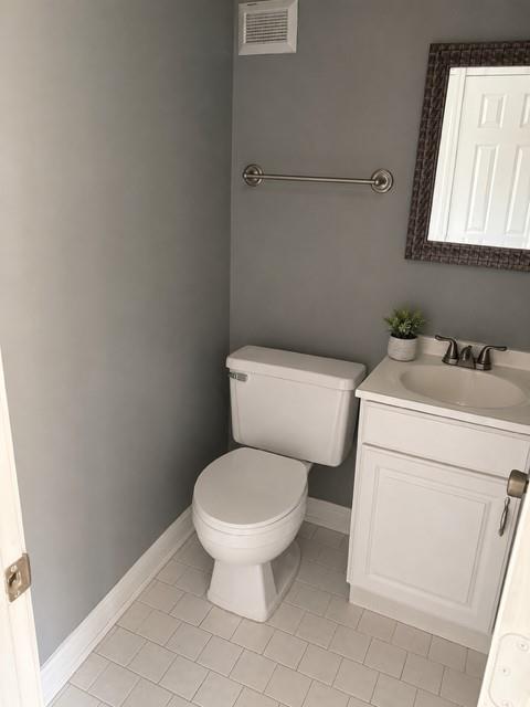 1625 Conley Road, Unit 38 Conley, GA 30288 - Photo 3 of 3 a white toilet sitting next to a bathroom sink