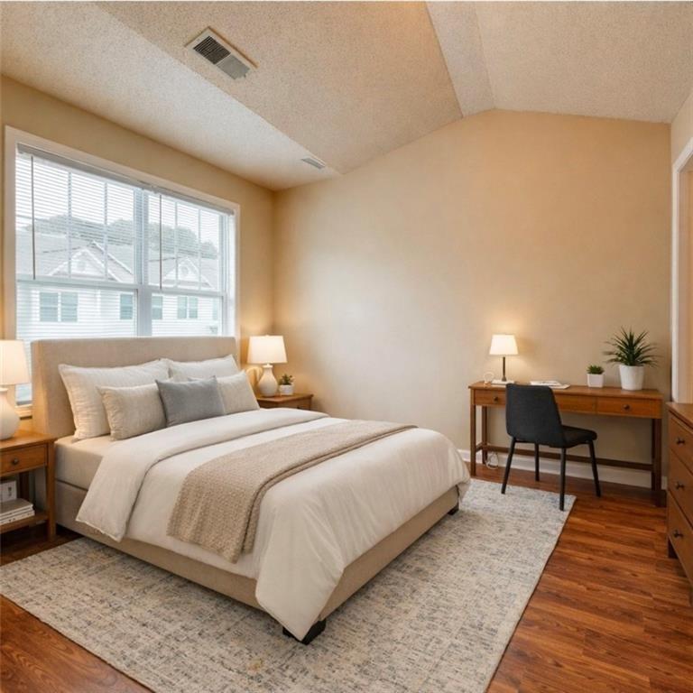 2837 Laurel Ridge Circle Atlanta, GA 30344 - Photo 12 of 20 a bedroom with a bed and a window