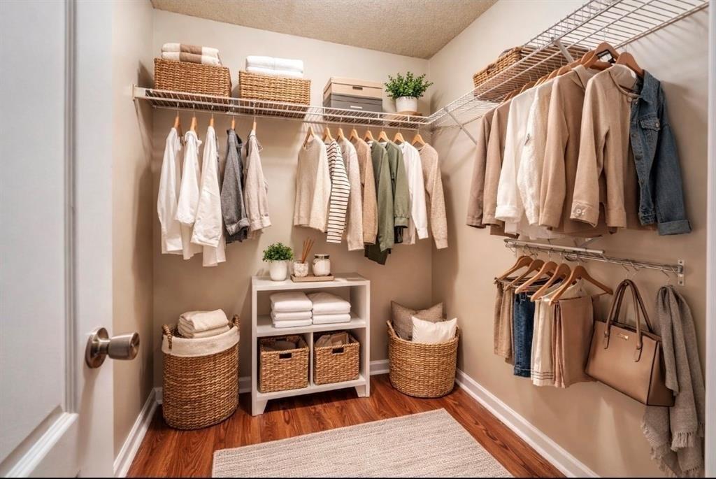 2837 Laurel Ridge Circle Atlanta, GA 30344 - Photo 13 of 20 a view of walk in closet with clothes and shoes