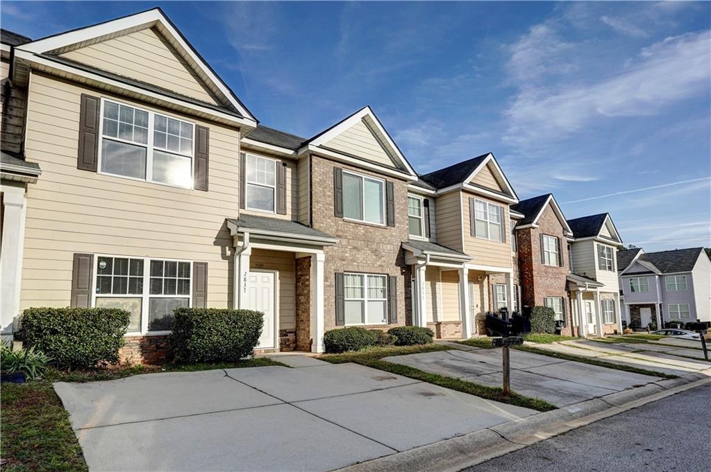 2837 Laurel Ridge Circle Atlanta, GA 30344 - Photo 2 of 20 a front view of a house with yard