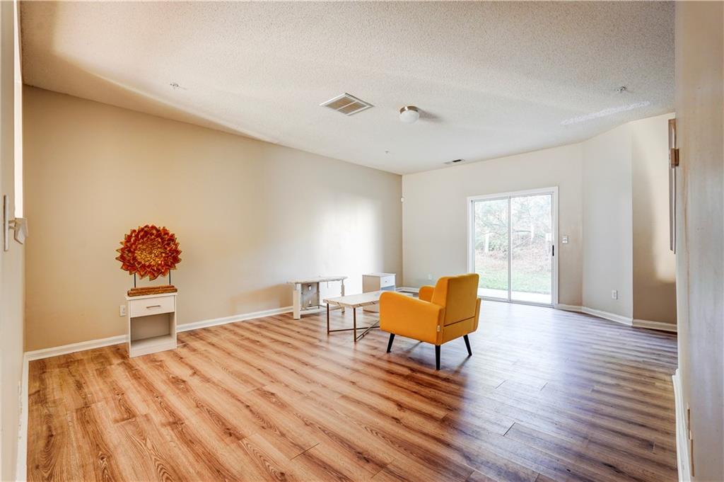2837 Laurel Ridge Circle Atlanta, GA 30344 - Photo 4 of 20 a living room with furniture and a wooden floor