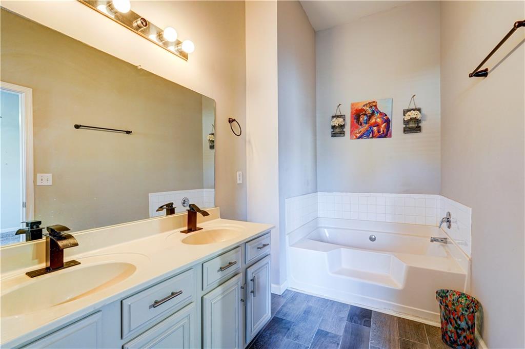 2837 Laurel Ridge Circle Atlanta, GA 30344 - Photo 10 of 20 a bathroom with a sink and a mirror