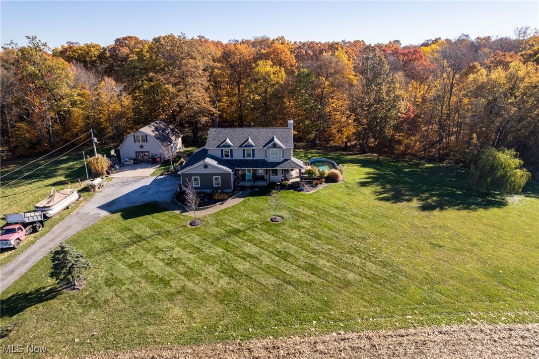 11827 Stratton Road West Salem, OH 44287 - Photo 14 of 47 View from above of property featuring a heavily wooded area