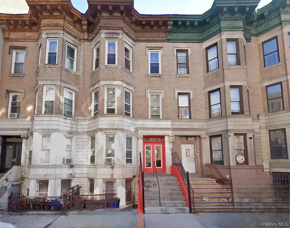 a front view of a residential apartment building with street view
