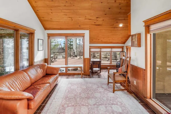 a bedroom that has a bed and a chair in it