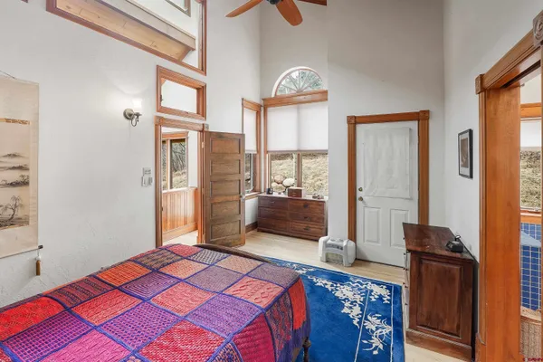 a view of a livingroom with furniture and bookshelf