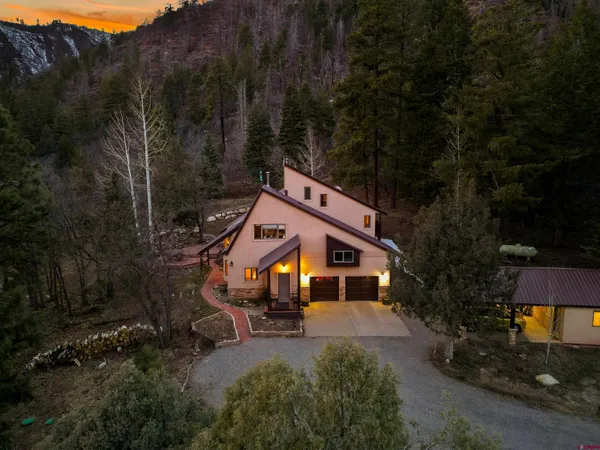 a aerial view of a house with a yard