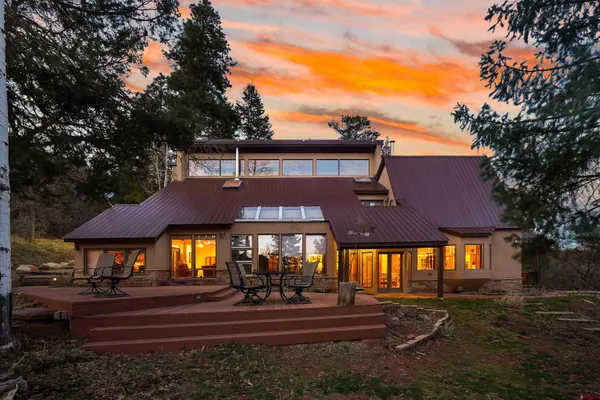 a aerial view of a house with a yard