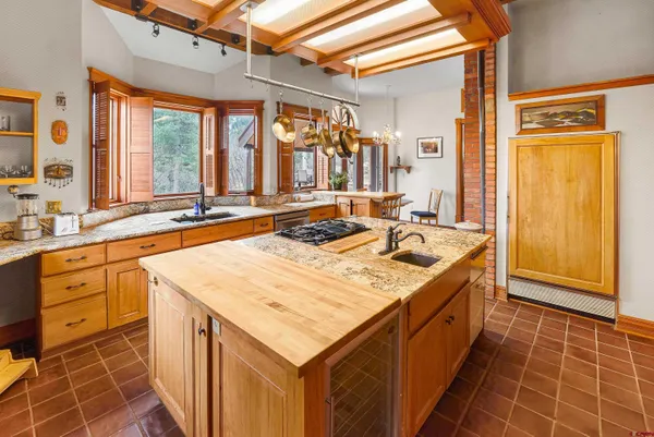 a view of a balcony with wooden floor and seating space