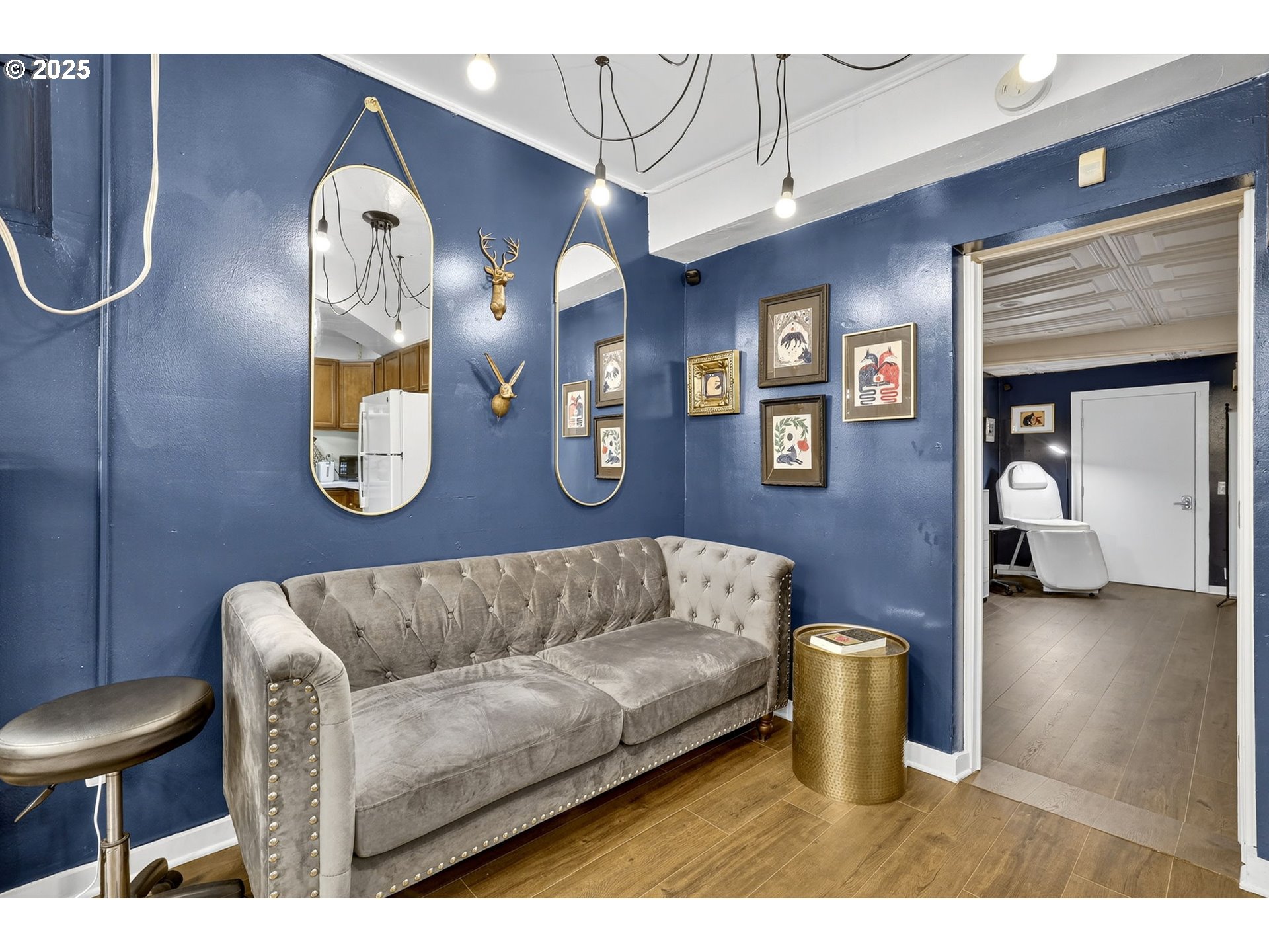 1104 Southwest Columbia Street, Unit 1 Portland, OR 97201 - Photo 6 of 20 a living room with furniture a flat screen tv and gym equipment
