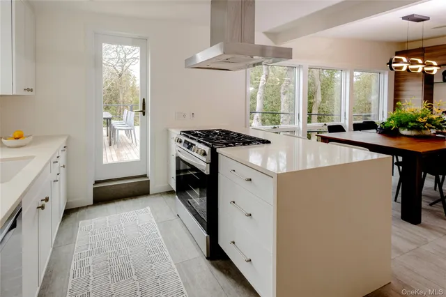 a kitchen with a stove a sink and a refrigerator