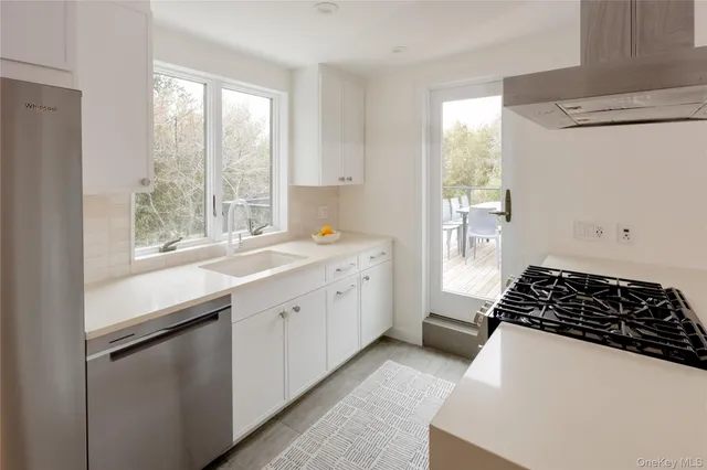 a kitchen with a sink and a window