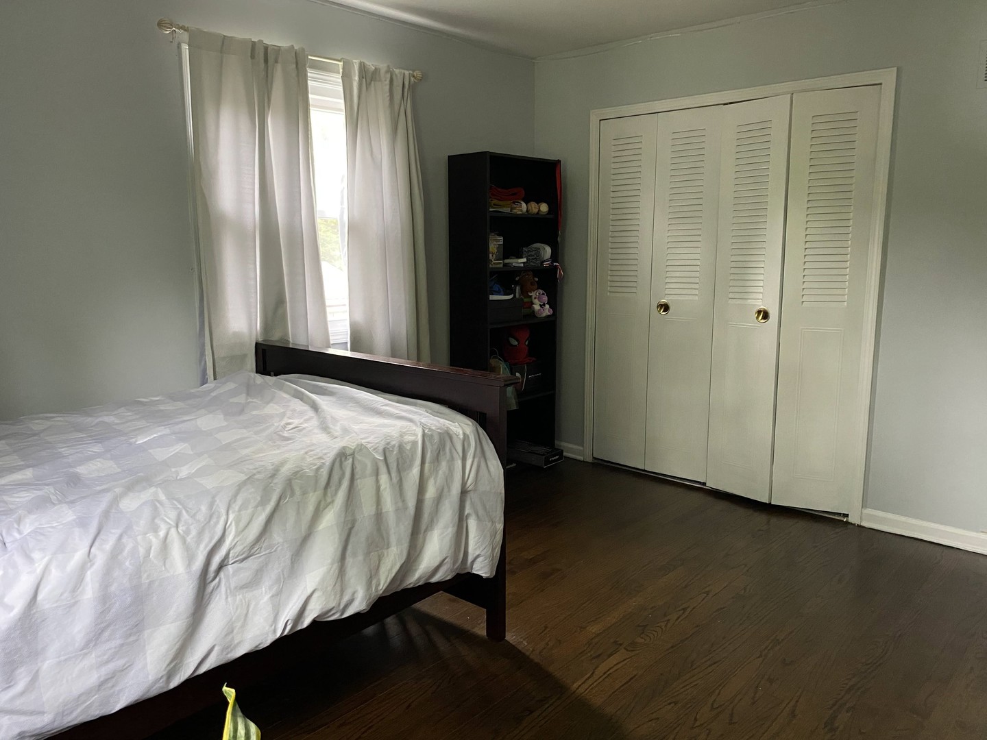 1408 Killdeer Drive Naperville, IL 60565 - Photo 27 of 43 a bed sitting in a bedroom next to a window and closet