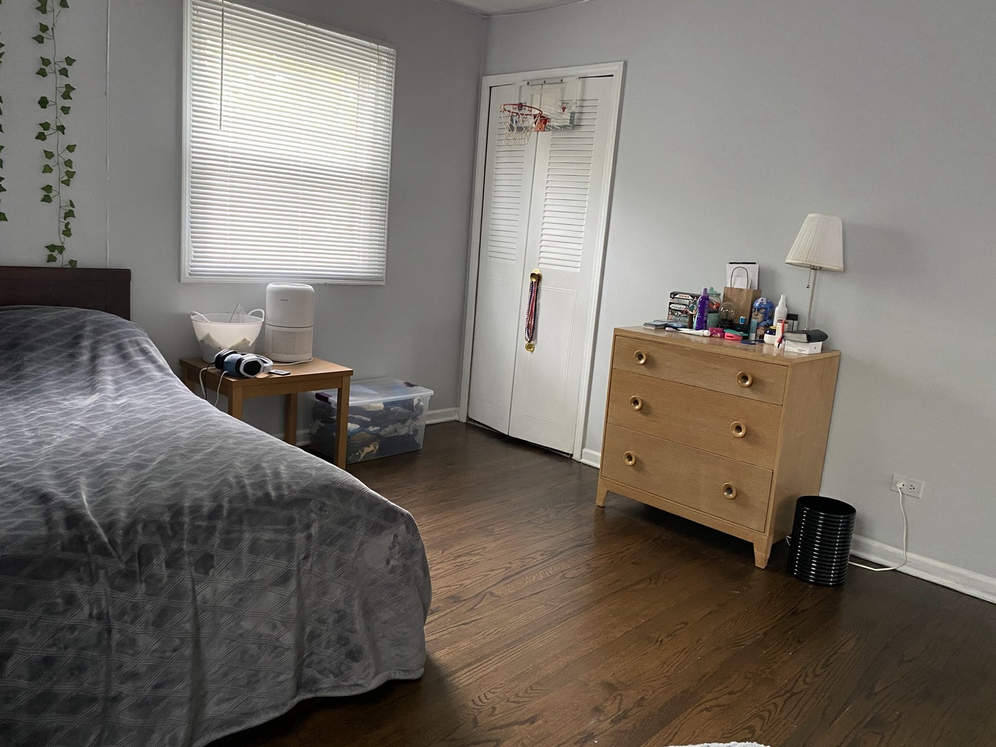 1408 Killdeer Drive Naperville, IL 60565 - Photo 32 of 43 a bedroom with a bed and wooden floor