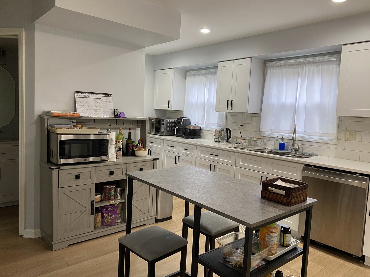 1408 Killdeer Drive Naperville, IL 60565 - Photo 6 of 43 a kitchen with a stove a sink cabinets and wooden floor
