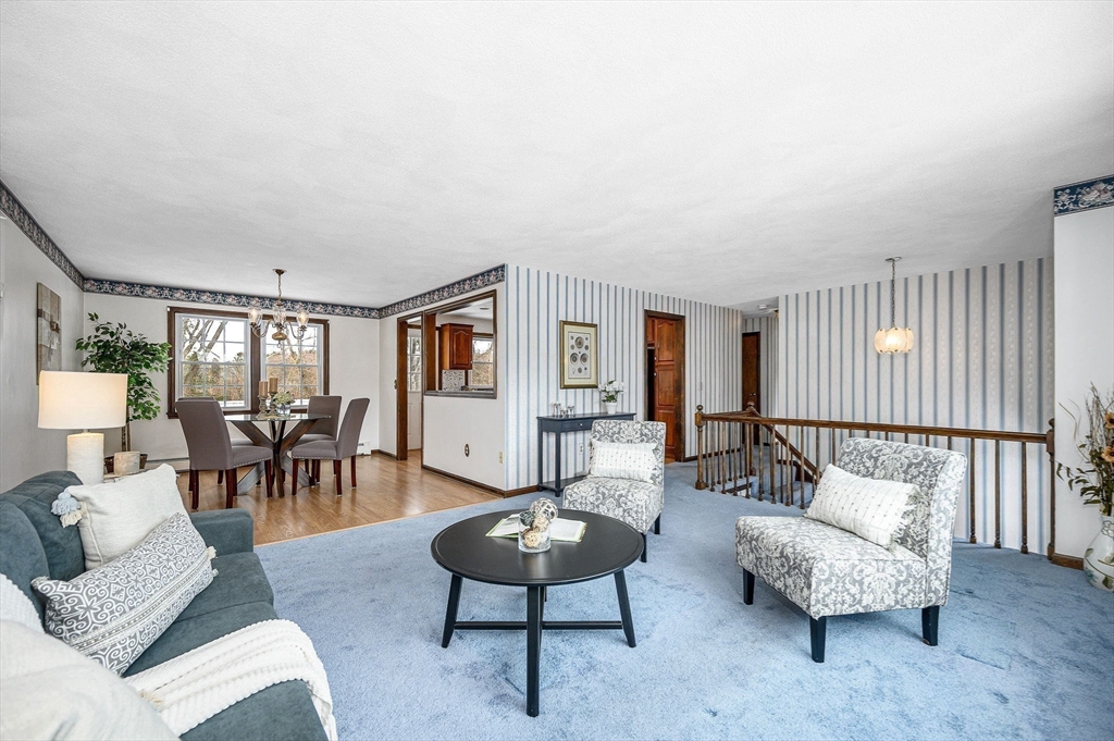 24 Benton Circle Reading, MA 01867 - Photo 12 of 41 a living room with furniture and a large window