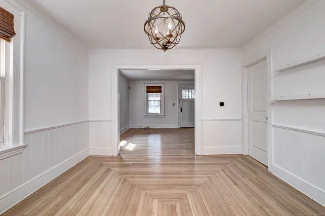 a view of livingroom with hardwood floor and kitchen view