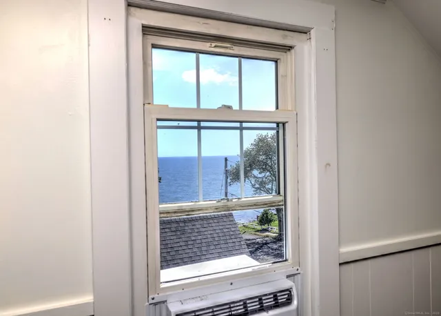 a room with window and stairs