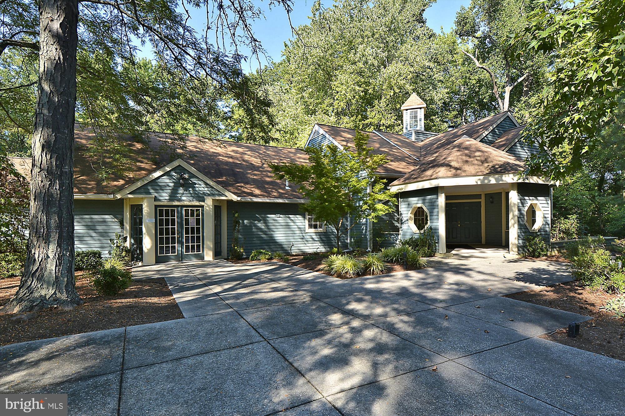 986 Breakwater Drive Annapolis, MD 21403 - Photo 25 of 31 a front view of a house with a yard and potted plants