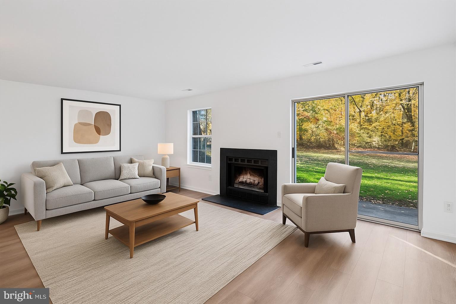 986 Breakwater Drive Annapolis, MD 21403 - Photo 6 of 31 a living room with furniture and a fireplace
