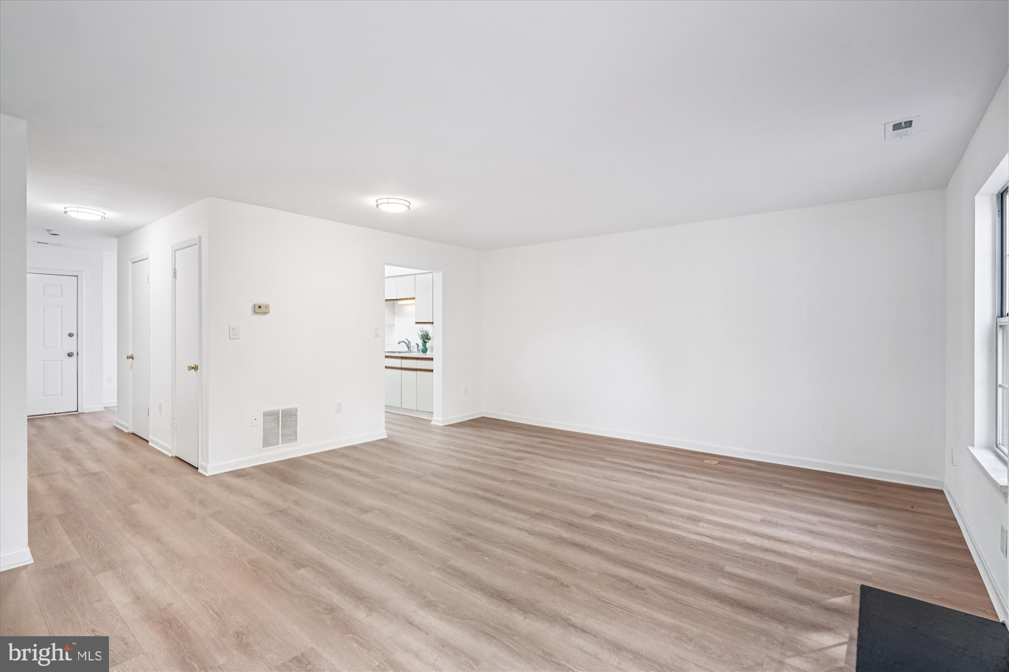 986 Breakwater Drive Annapolis, MD 21403 - Photo 9 of 31 a view of an empty room with wooden floor