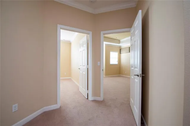 an empty room that has a wooden cupboard