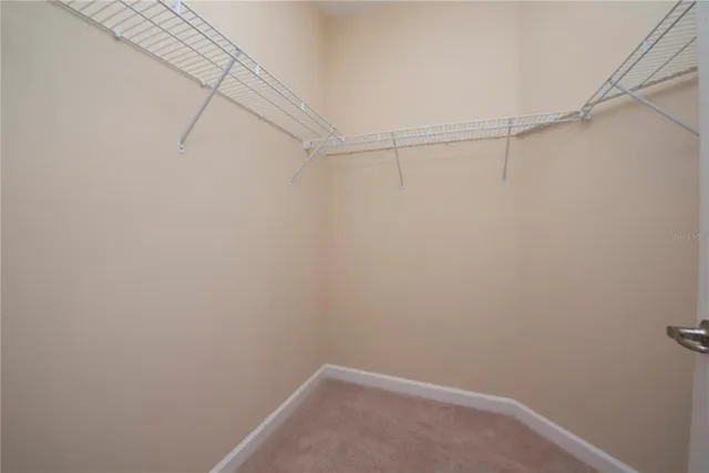 a bathroom with a granite countertop sink and a bathtub