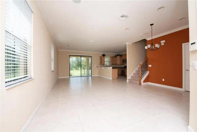 a view of empty room with a fireplace