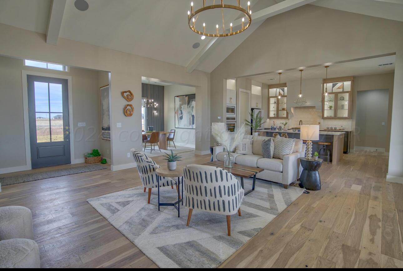 19181 Buck Springs Road Amarillo, TX 79119 - Photo 17 of 86 a living room with furniture and wooden floor