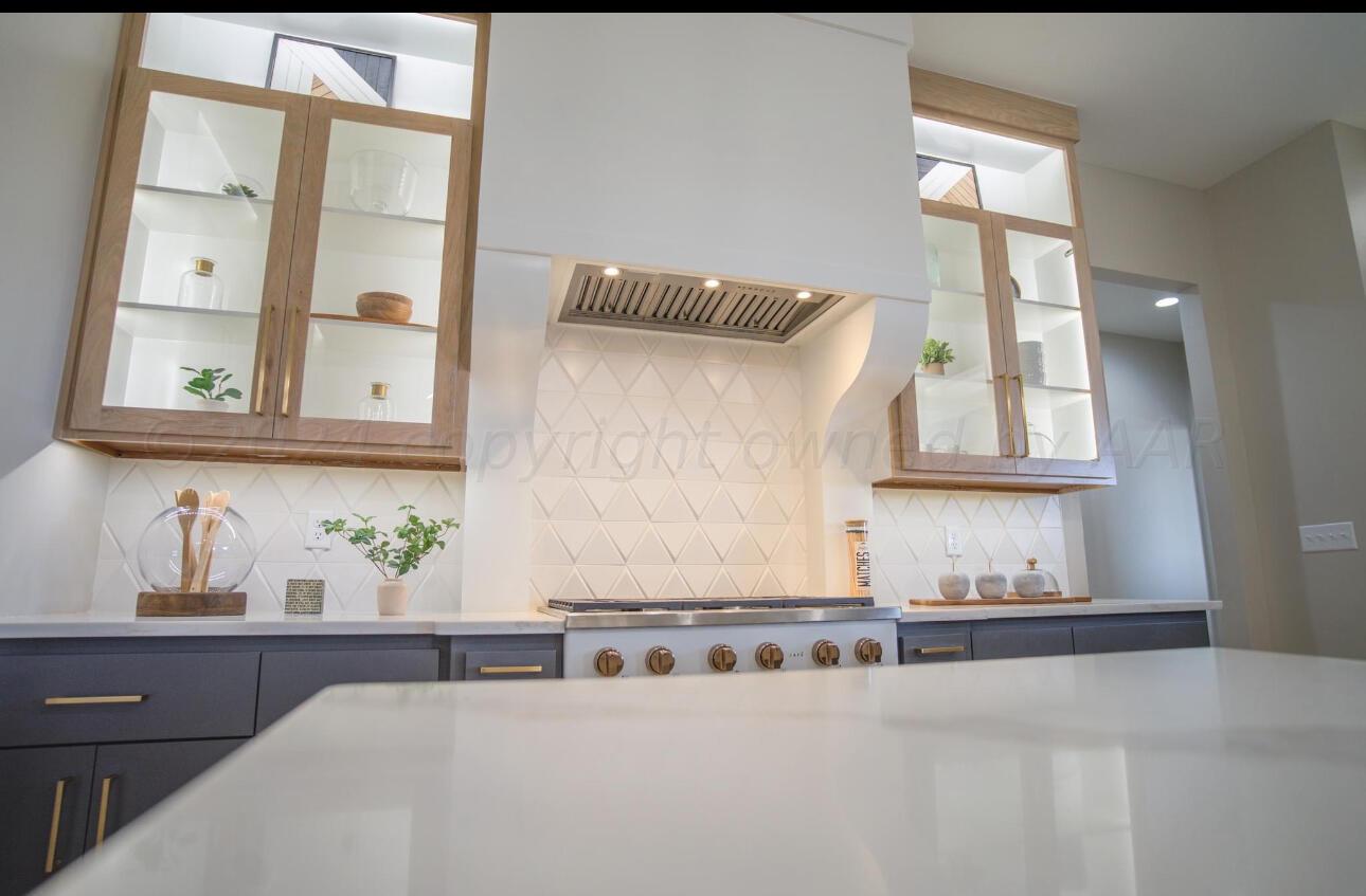 19181 Buck Springs Road Amarillo, TX 79119 - Photo 26 of 86 a bathroom with a granite countertop sink and a mirror