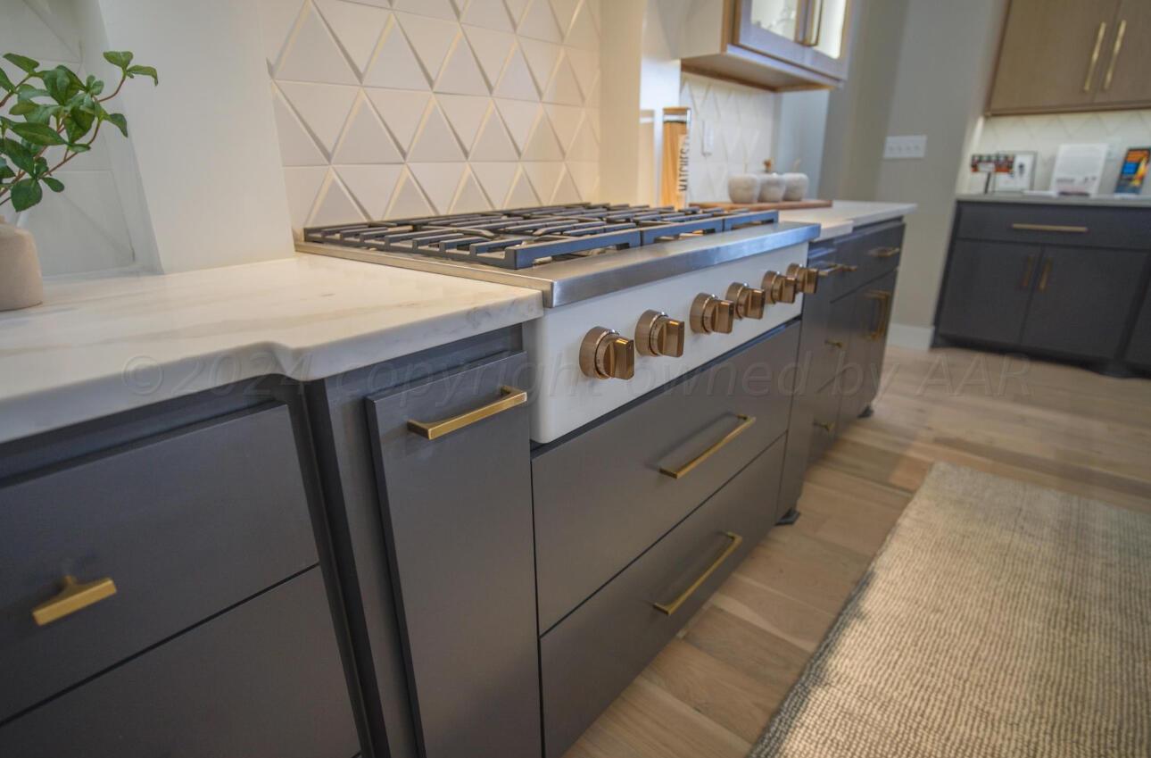 19181 Buck Springs Road Amarillo, TX 79119 - Photo 27 of 86 a stove top oven sitting inside of a kitchen