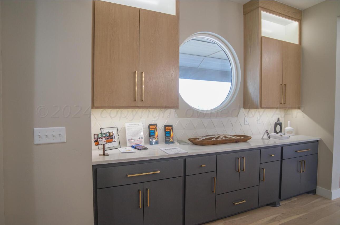 19181 Buck Springs Road Amarillo, TX 79119 - Photo 36 of 86 a bathroom with a granite countertop double vanity sink and a mirror