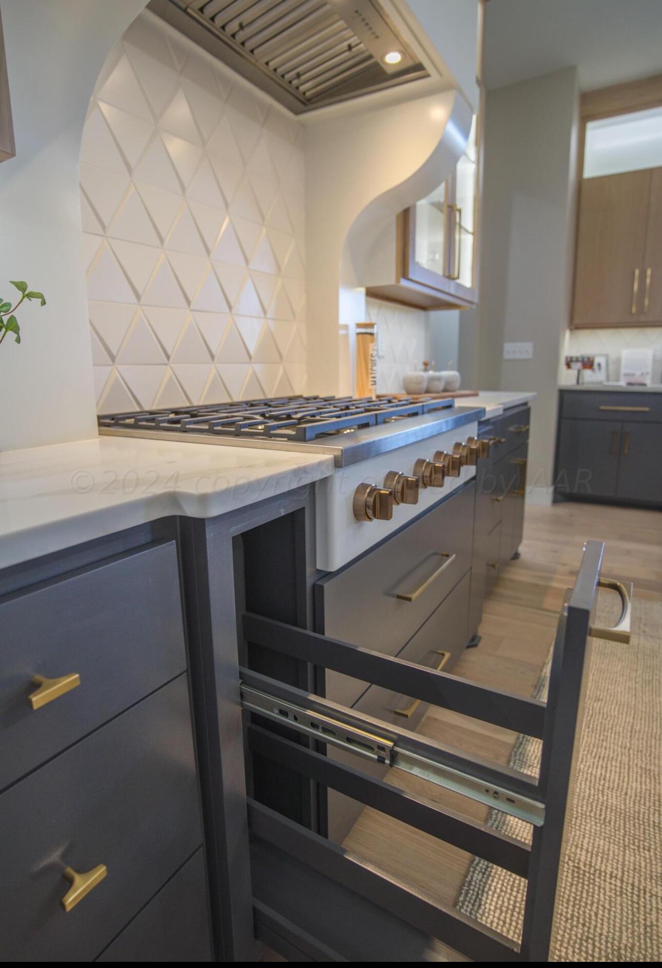 19181 Buck Springs Road Amarillo, TX 79119 - Photo 37 of 86 a stove top oven sitting inside of a kitchen