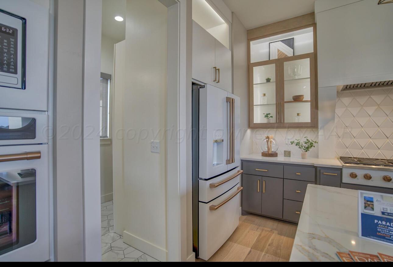 19181 Buck Springs Road Amarillo, TX 79119 - Photo 39 of 86 a kitchen with stainless steel appliances granite countertop a refrigerator and a stove top oven
