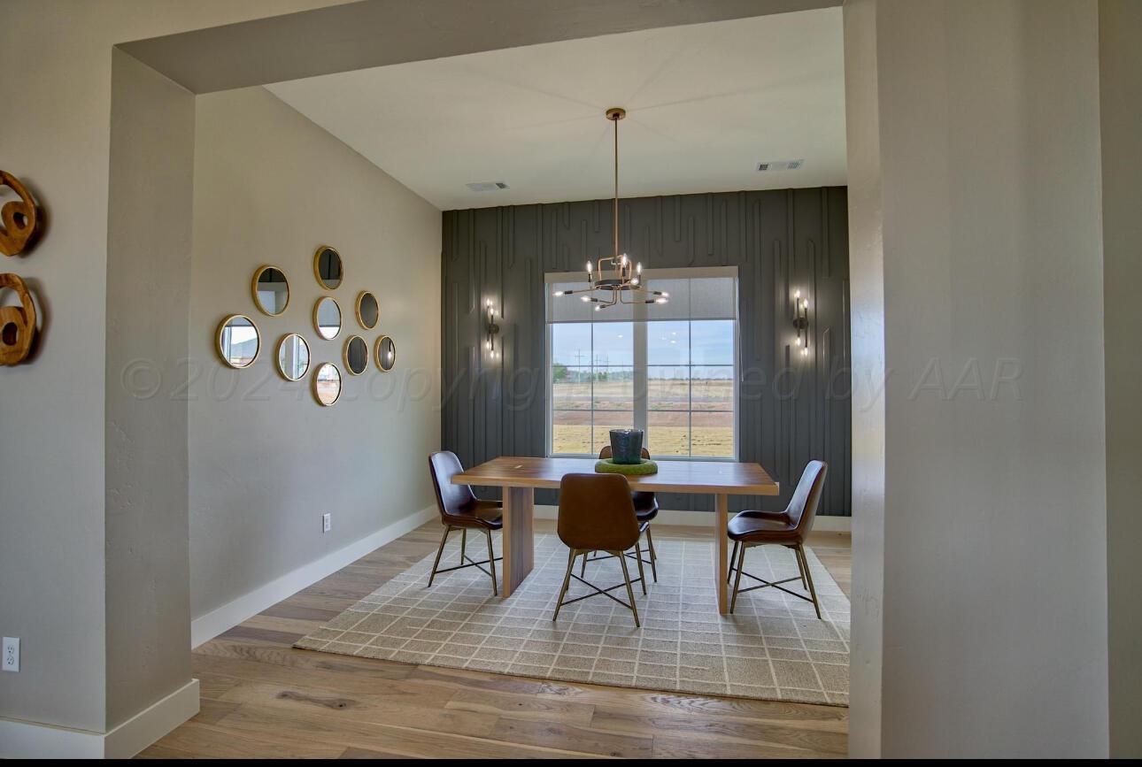 19181 Buck Springs Road Amarillo, TX 79119 - Photo 48 of 86 a view of a dining room with furniture and chandelier