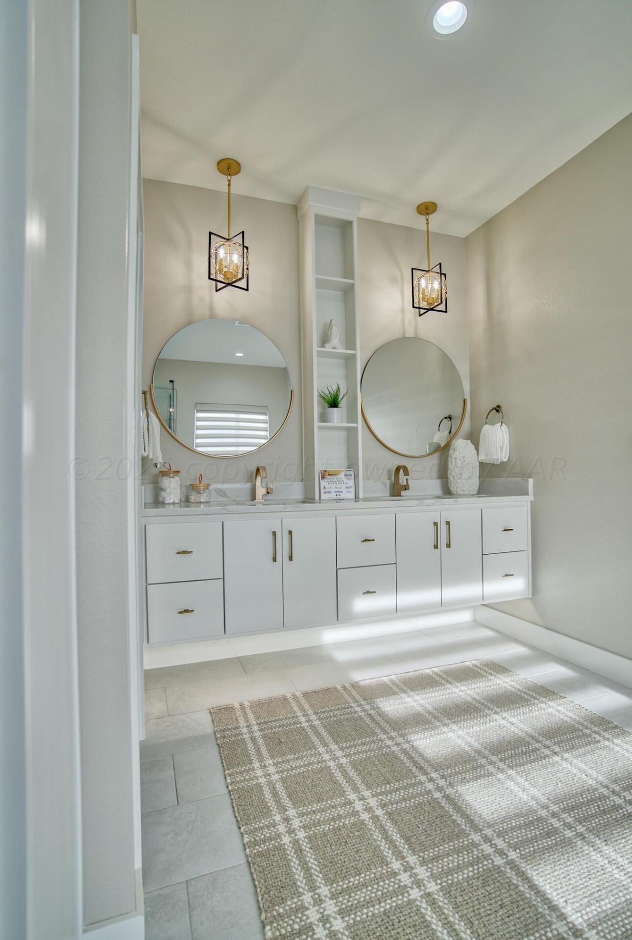 19181 Buck Springs Road Amarillo, TX 79119 - Photo 67 of 86 a bathroom with double vanity sink and mirror