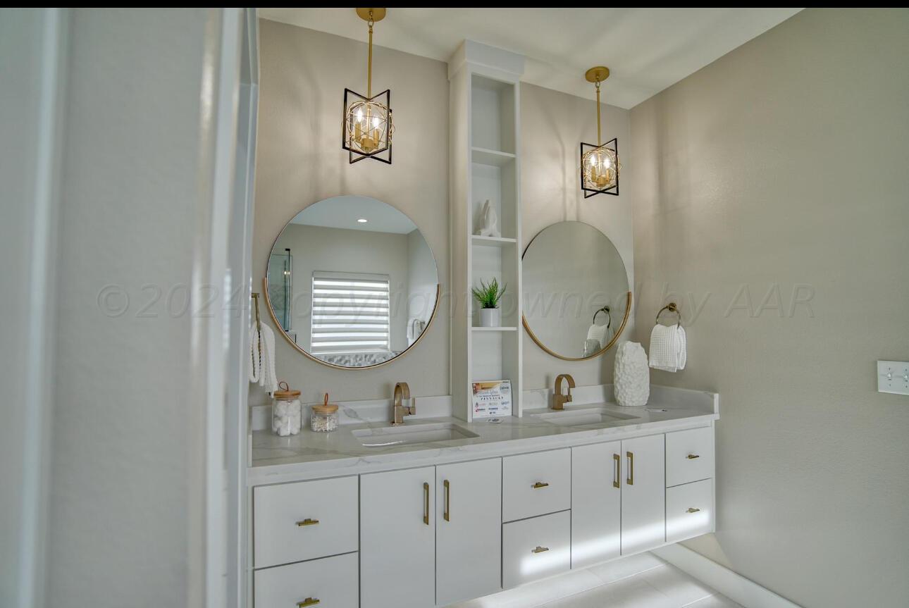 19181 Buck Springs Road Amarillo, TX 79119 - Photo 68 of 86 a bathroom with double vanity sink and a mirror