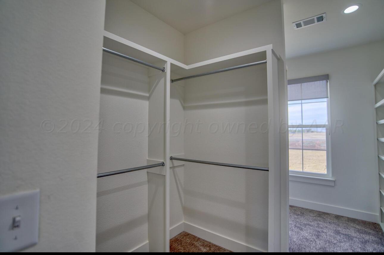 19181 Buck Springs Road Amarillo, TX 79119 - Photo 73 of 86 a bathroom with a glass shower door