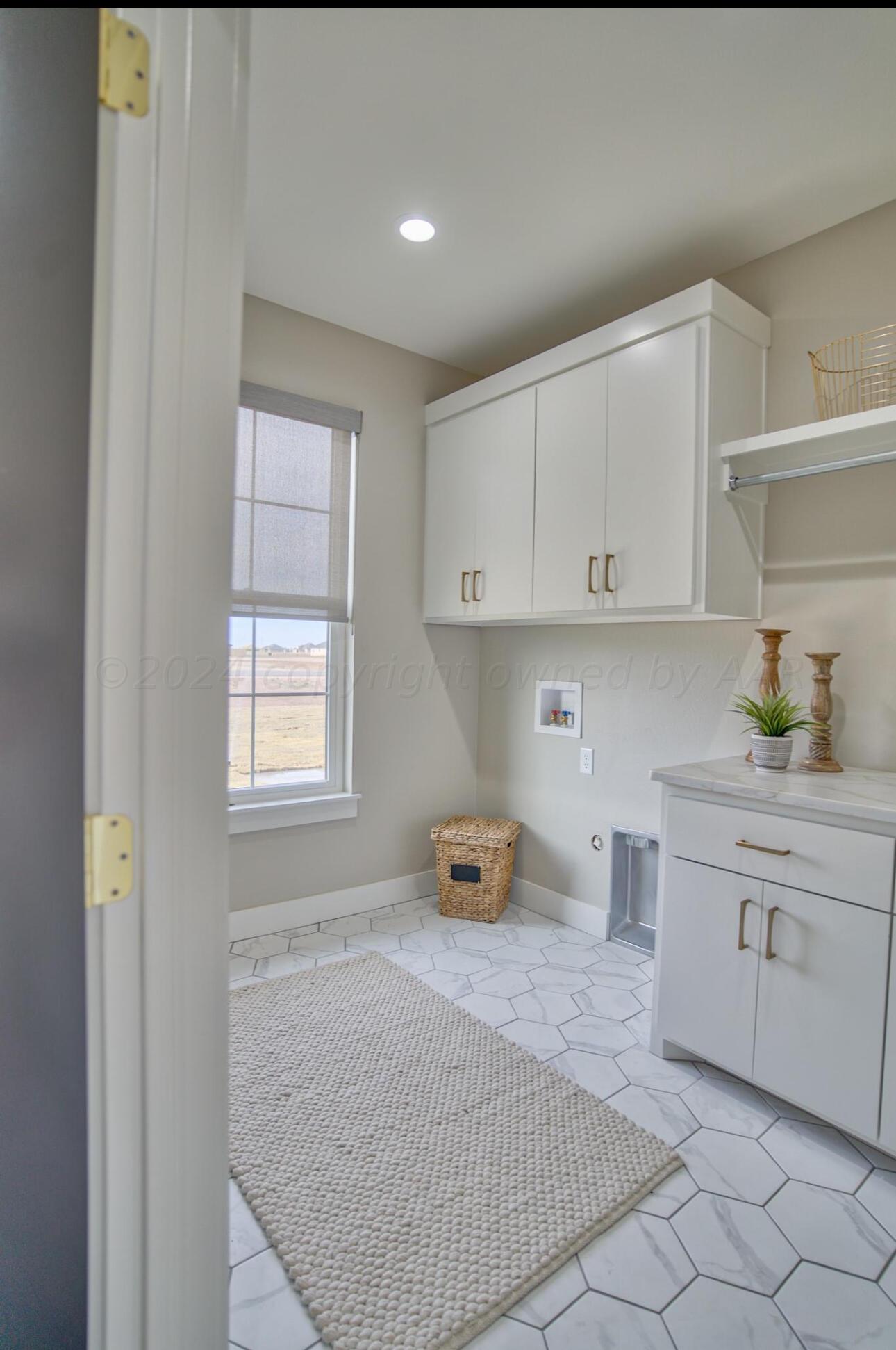 19181 Buck Springs Road Amarillo, TX 79119 - Photo 77 of 86 a kitchen with stainless steel appliances granite countertop a sink stove and cabinets