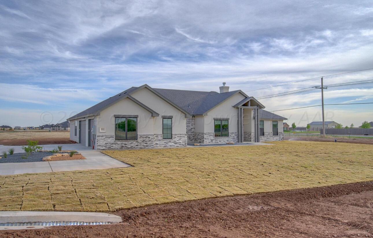 19181 Buck Springs Road Amarillo, TX 79119 - Photo 84 of 86 a front view of house with yard and ocean