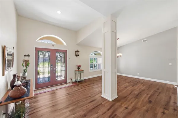 a spacious bedroom with a bed and a dresser