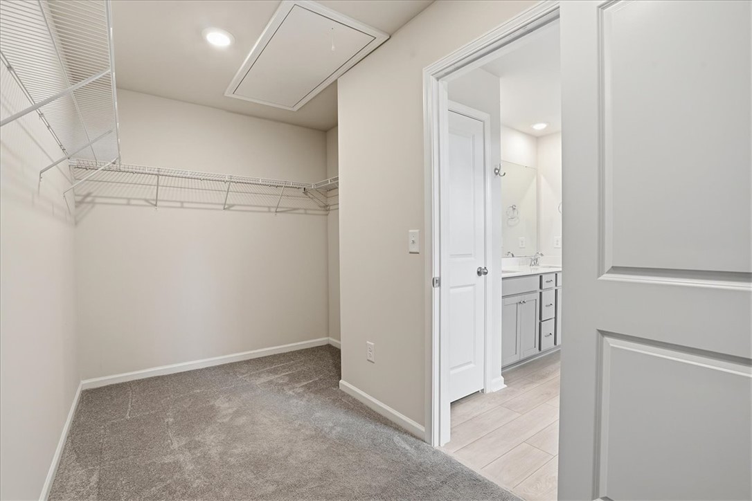 365 Sliding Rock Drive Pendleton, SC 29670 - Photo 30 of 46 Ample closet space with practical shelving, connecting to a pristine bathroom.