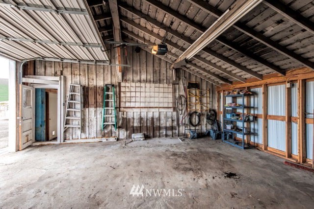 9590 Smith Springs Road Prescott, WA 99348 - Photo 27 of 40 a view of an empty room with wooden walls